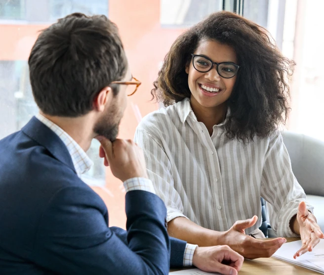 Two people in discussion in an office