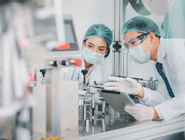 Two science lab workers in discussion