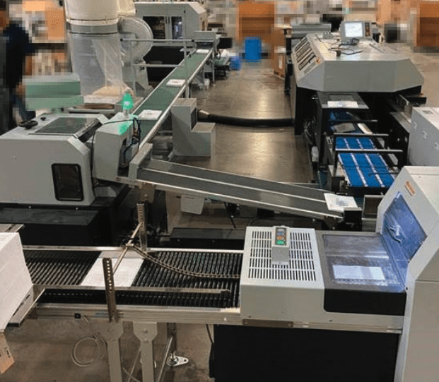 The Horizon SB-09V Perfect Binder runs inline with the HT-1000V Three-knife Trimmer at 3,000 books per hour to seamlessly handle the increased volume required by a KP Corp client.